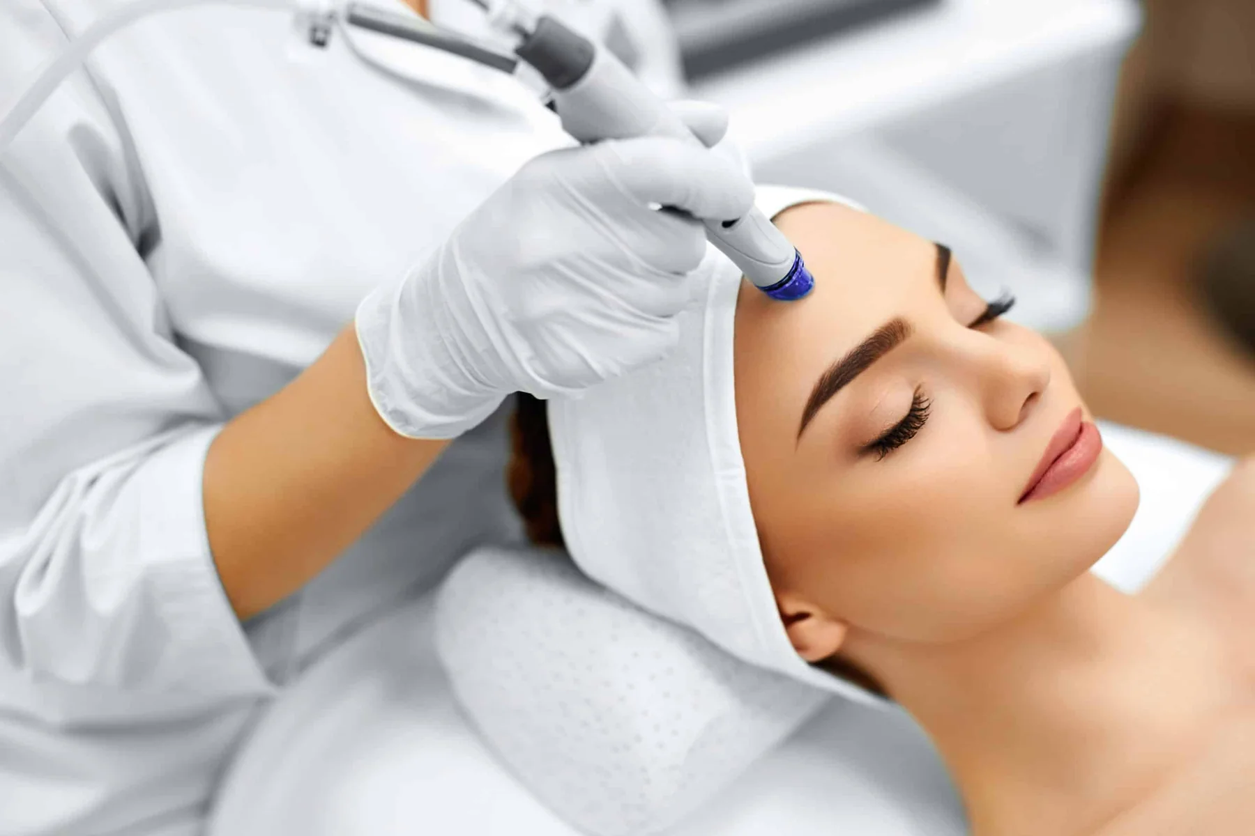 woman receives diamond glow facial